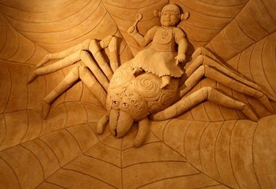 A sand sculpture entitled 'Little Miss Muffet' carved by Hanneke Supply from Belgium is seen at the Creepy Crawlies Sand Sculpting Exhibition on the Frankston waterfront on December 26, 2010 in Melbourne, Australia. International sand sculpture artists from around the world teamed up with their Australian counterparts to create the insect themed exhibition that will be open to the public until April, 2011.