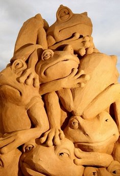 A sand sculpture entitled 'Frogs Galore' carved by Susanne Ruseler from the Netherlands and Hanneke Supply from Belgium is seen at the Creepy Crawlies Sand Sculpting Exhibition on the Frankston waterfront on December 26, 2010 in Melbourne, Australia. International sand sculpture artists from around the world teamed up with their Australian counterparts to create the insect themed exhibition that will be open to the public until April, 2011.